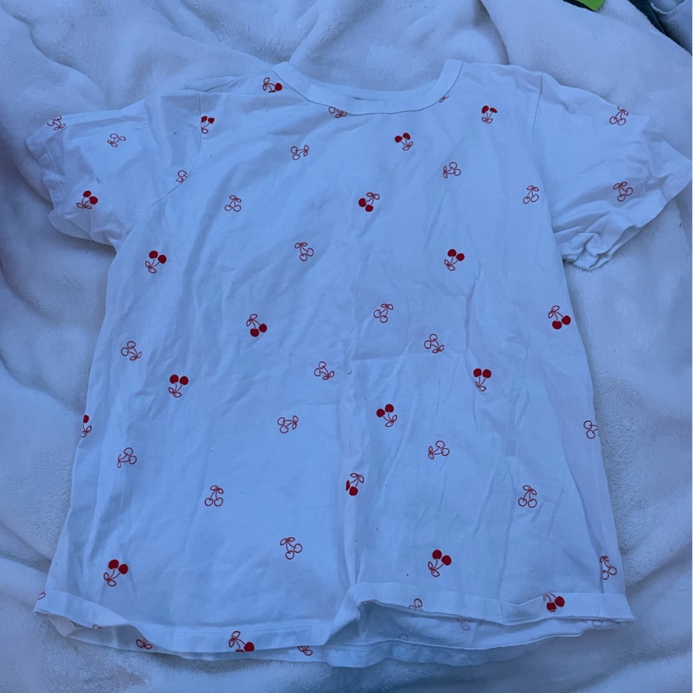 White basic cherry top. Loose fitting. Great for summer!